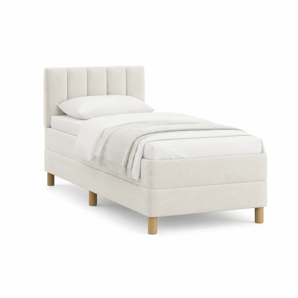 Lit simple capitonné 90 x 190 cm en polyester crème avec sommier à lattes et pieds en bois massif